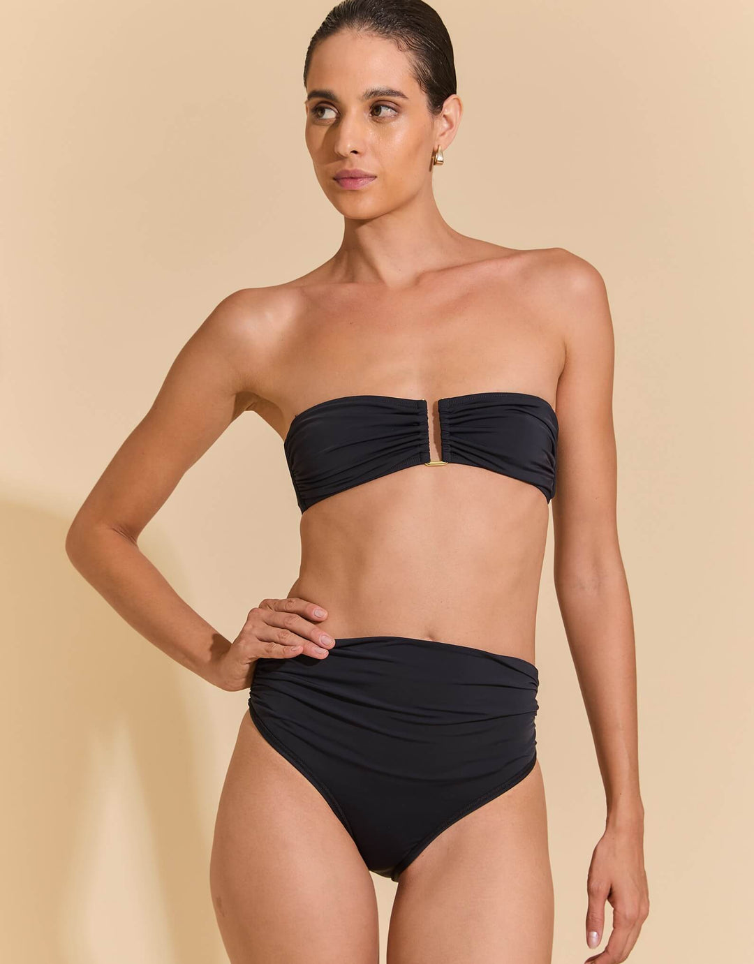 Lenny Niemeyer Black Drop Bandeau Bikini Top with gathered cups, gold-plated hardware, SPF 50+ fabric, available at Catriona.