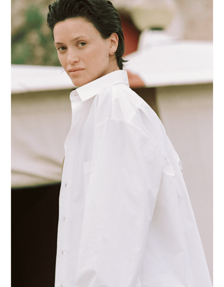 Lido oversized cotton poplin shirt in Chalk white with rounded hem and pearl buttons