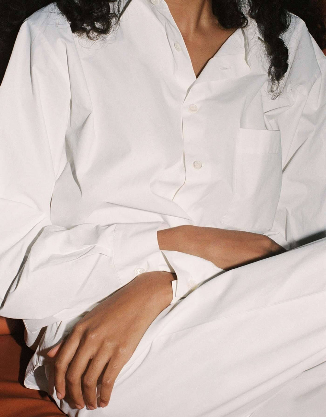 Lido oversized cotton poplin shirt in Chalk white with rounded hem and pearl buttons
