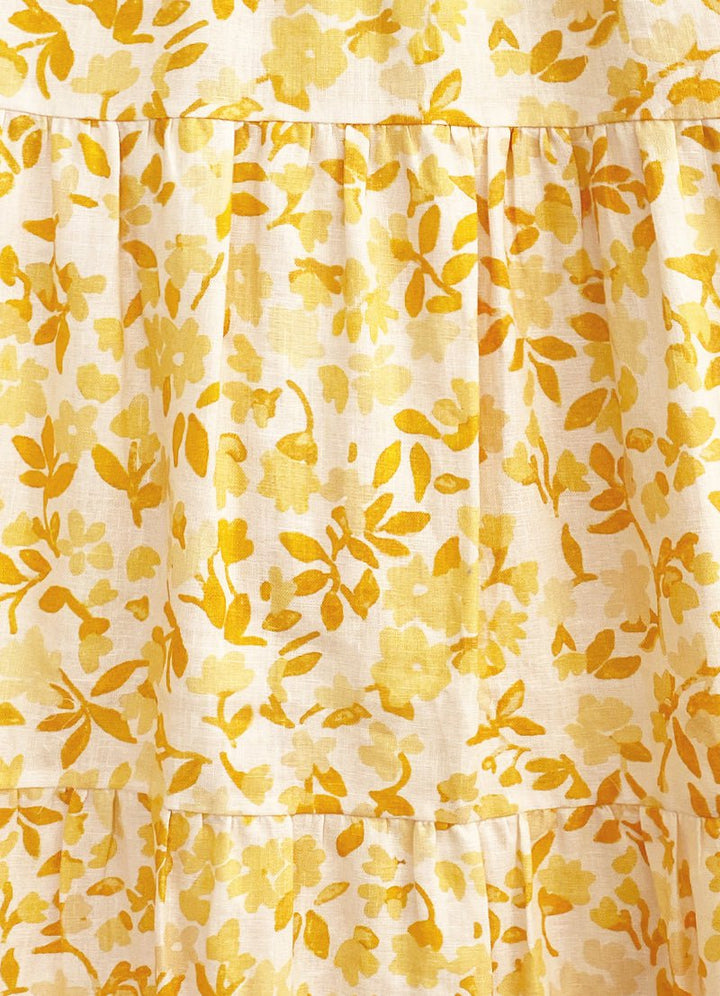 Effortless maxi dress with contoured bodice, open back, adjustable ties, and relaxed skirt in Peony's Daffodil floral print.