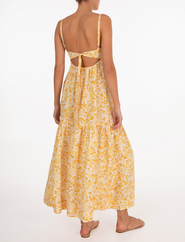 Effortless maxi dress with contoured bodice, open back, adjustable ties, and relaxed skirt in Peony's Daffodil floral print.