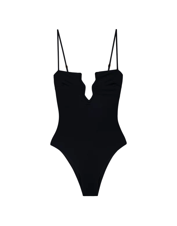 Black one piece swimsuit with zig-zag cut out and adjustable straps by Fisch.