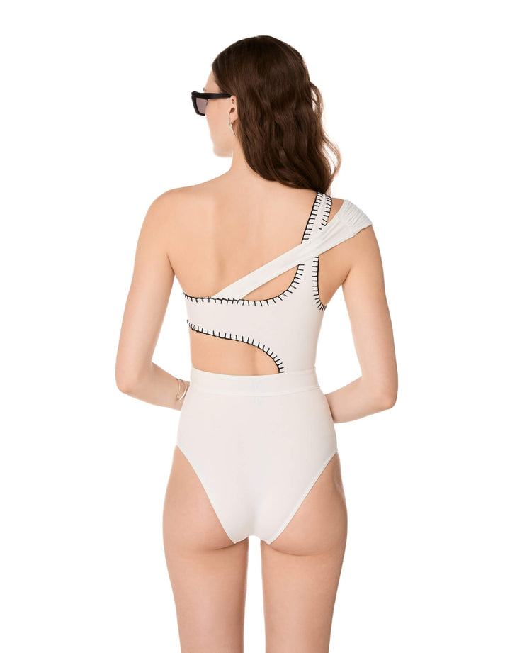 Kióhne Hestia white one-shoulder swimsuit with handmade embroidery detail and cut-out waist, back view