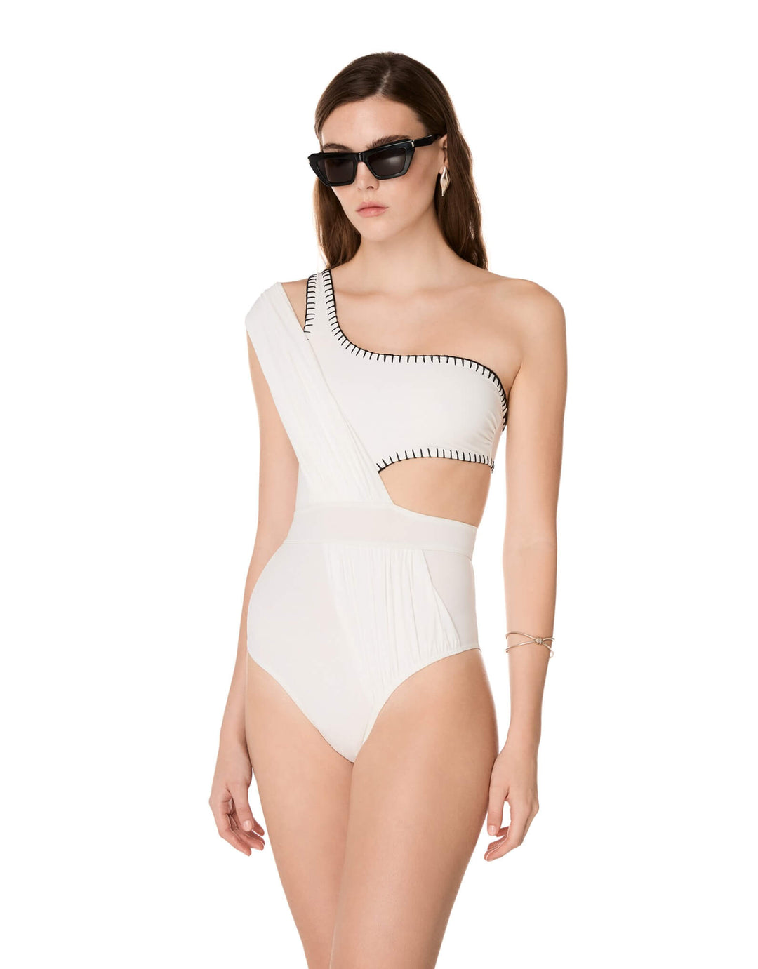 Kióhne Hestia white one-shoulder swimsuit with handmade embroidery detail and cut-out waist