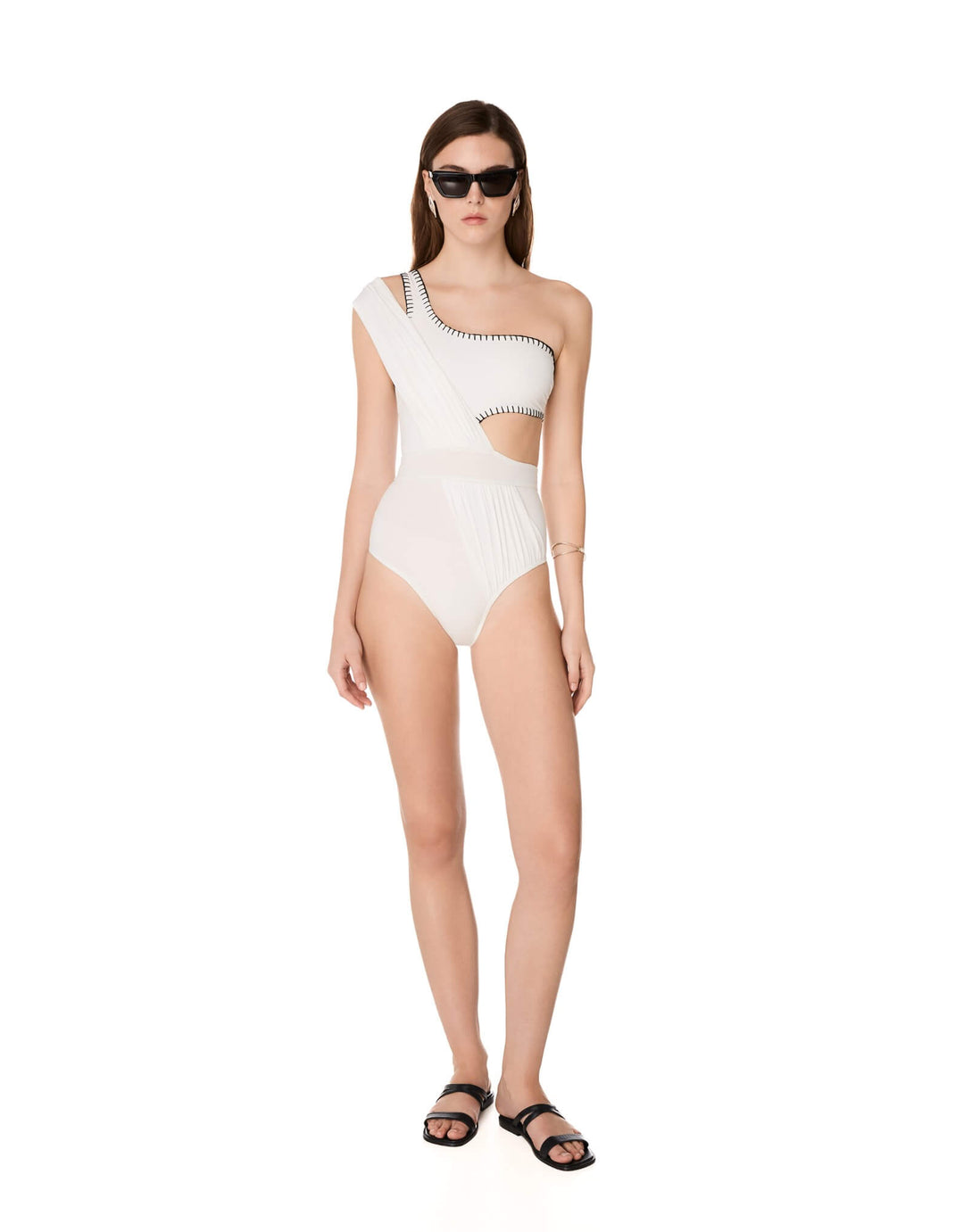 Kióhne Hestia white one-shoulder swimsuit with handmade embroidery detail and cut-out waist