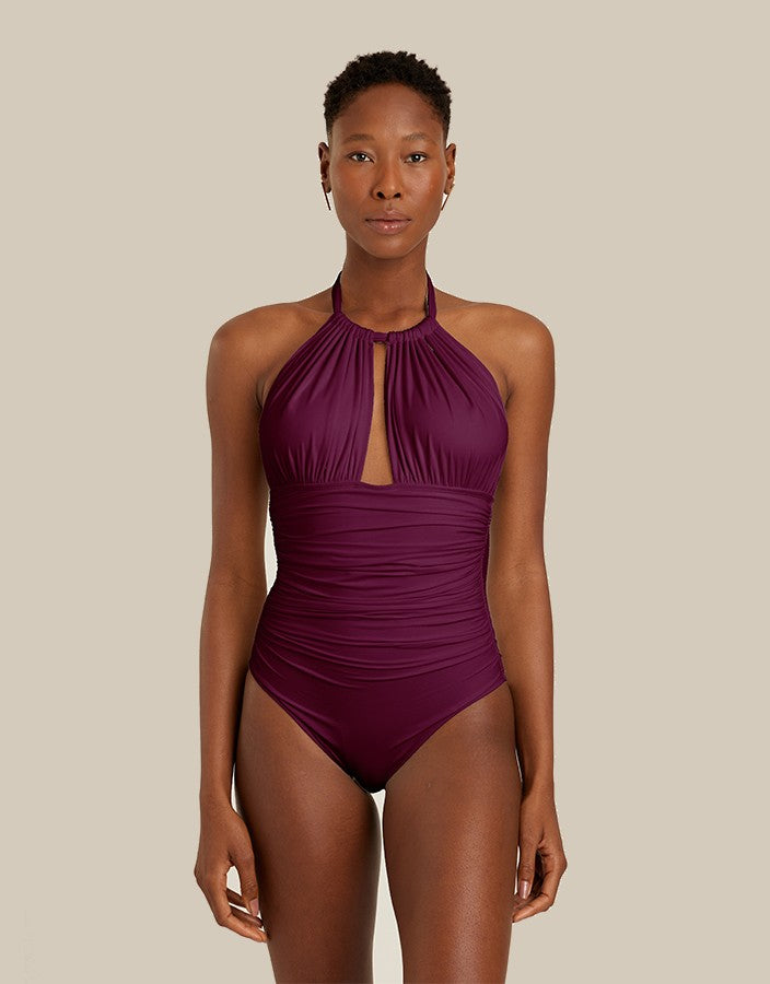 Elegant Carmine one-piece swimsuit with adjustable halter and ruched bodice by Lenny Niemeyer.