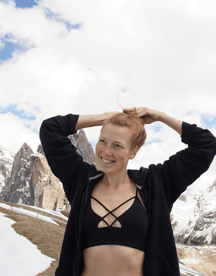 Essentials for Zula Olympia Bralette Black — outdoor lifestyle pose in snowy setting