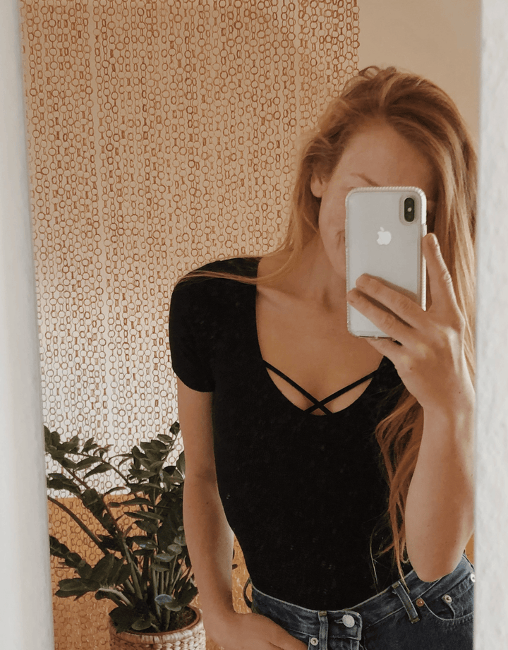 Essentials for Zula Olympia Bralette Black — mirror selfie lifestyle shot indoors