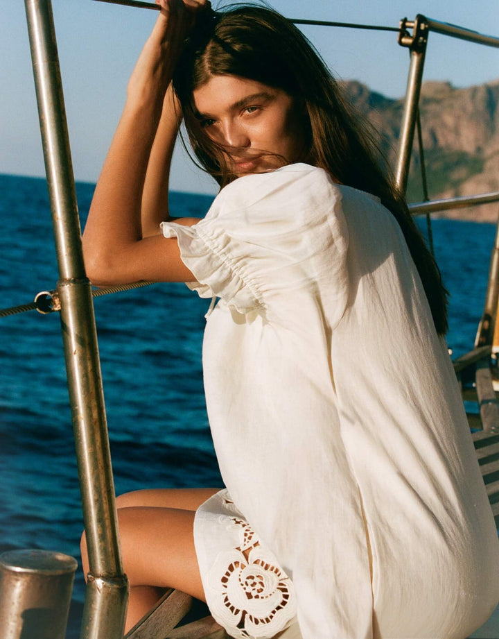 Peony Embroidered Poets Mini Dress in Gardenia linen mini dress with puff sleeves and floral embroidered hem