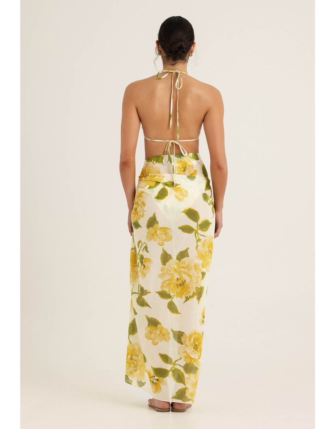 Peony Clair De Lune sarong in yellow floral print draped around the body