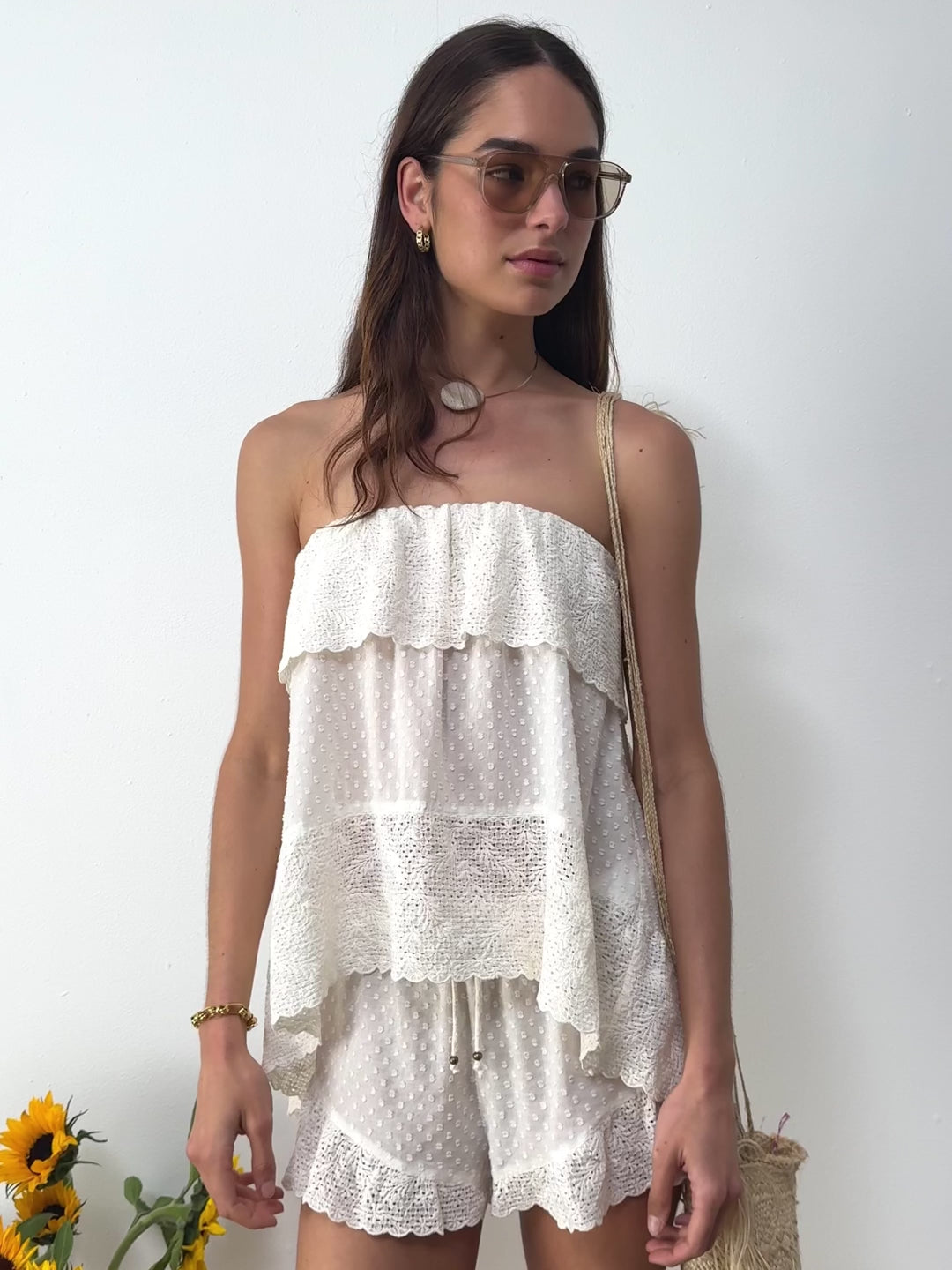 Boteh Serenia white Strapless Frill Top and short  — model close-up with sunglasses