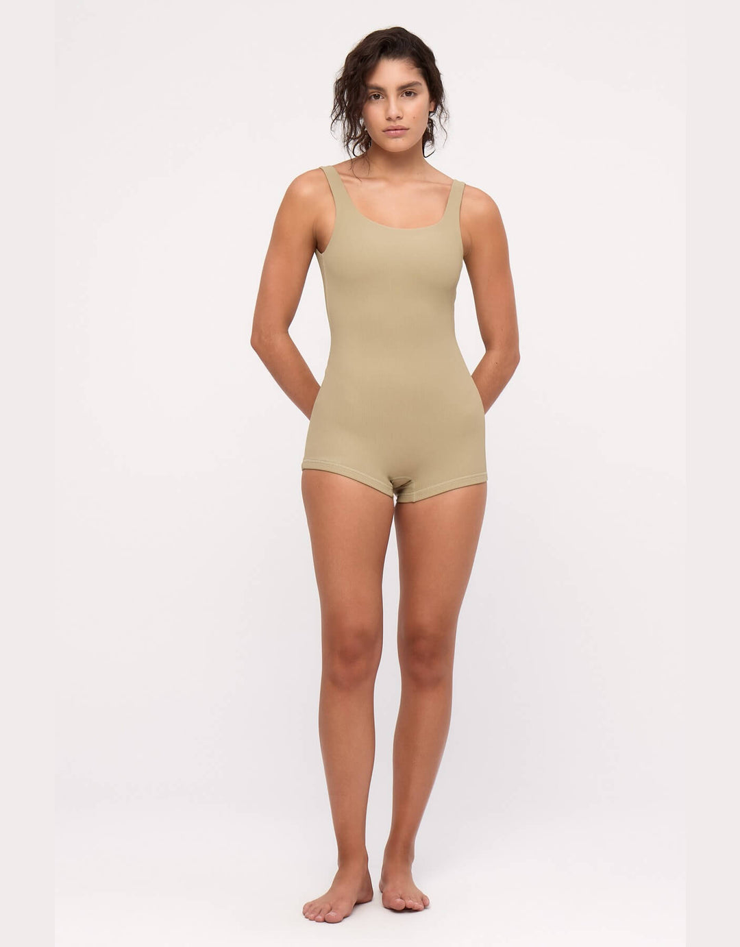 Model wearing Zulu and Zephyr Stripe Rib Bodysuit in Olive