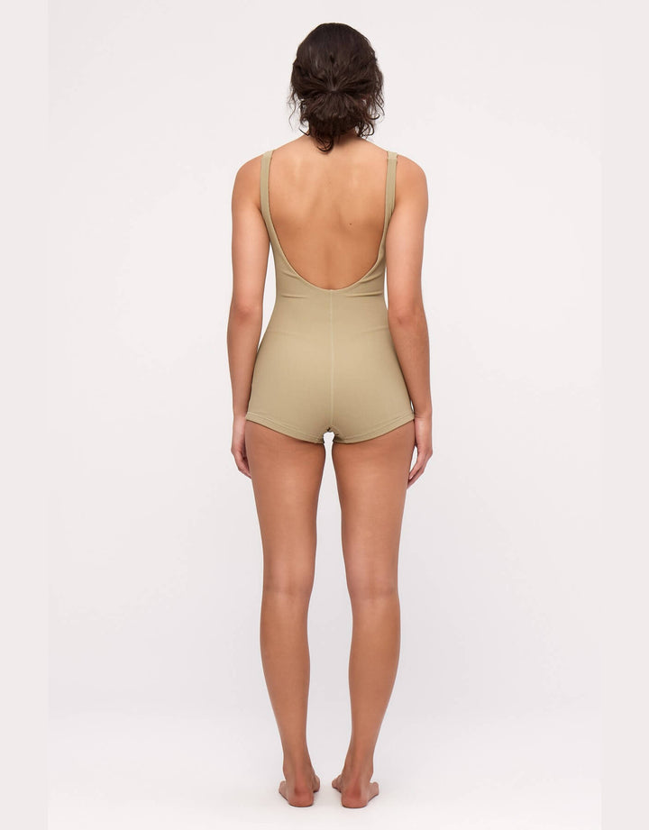 Model wearing Zulu and Zephyr Stripe Rib Bodysuit in Olive