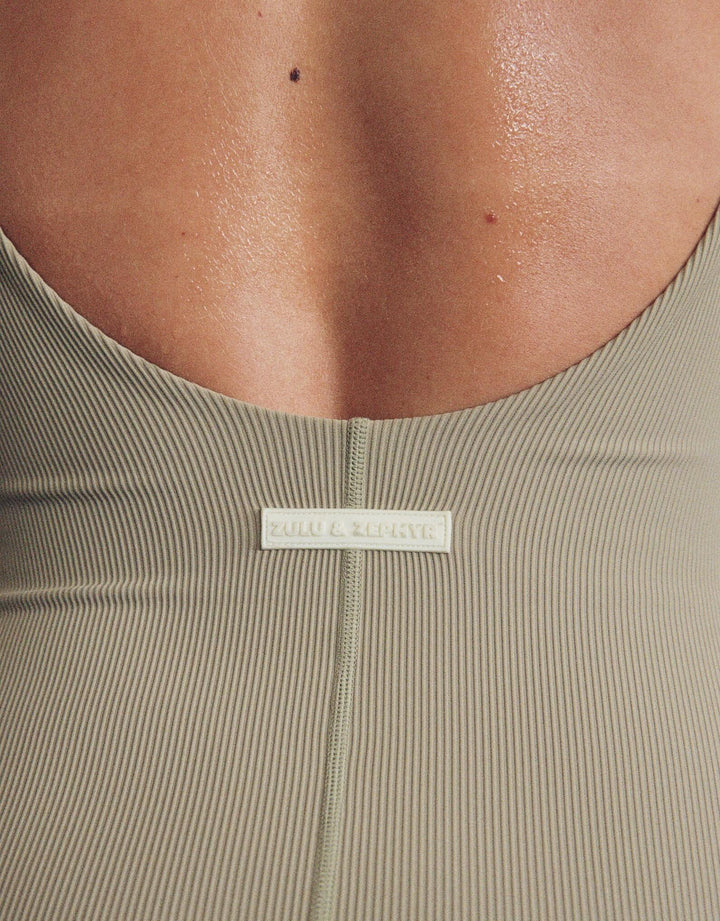 Model wearing Zulu and Zephyr Stripe Rib Bodysuit in Olive