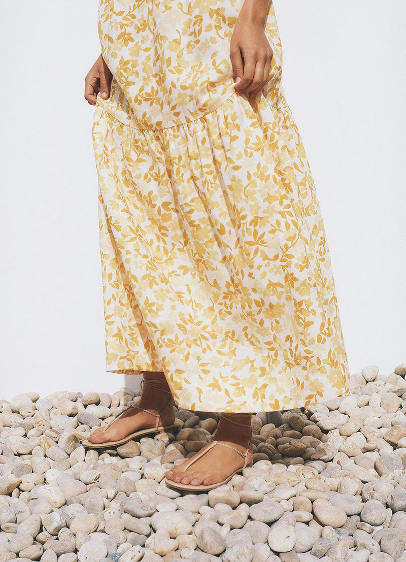 Effortless maxi dress with contoured bodice, open back, adjustable ties, and relaxed skirt in Peony's Daffodil floral print.